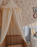 frill canopy over a cot