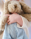 Meet Mr Honey Bunny by Nana Huchy, a beautifully soft bunny dressed in your choice of pink or blue striped overalls. 