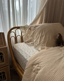 Vintage Rose sheet set close up in soft cotton muslin featuring romantic floral print in soft blush and cream tones, and vintage-inspired charm for dreamy bedrooms.