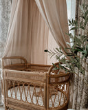 Baby nursery featuring Moon and Back bassinet sheet and storybook canopy