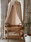 Canopy magic in a little nursery over a bassinet