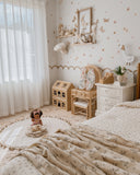 Vintage Rose quilt layered with coordinating bedding (Bluebell Blanket) By Moon and Back Collective.