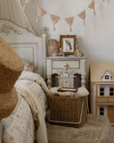 Little House on the Prairie quilt set for children featuring heirloom-inspired floral bedding in soft cotton muslin.
