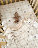 Rocking Around reversible cotton baby blanket with hand-painted rocking horse print, gingham reverse and lace trim by Moon & Back Collective.